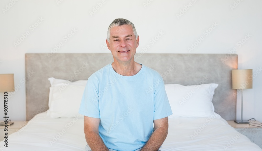 Senior man sitting on bed Senior man sitting on bed