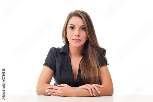 Satisfied businesswoman at the desk on white background.
