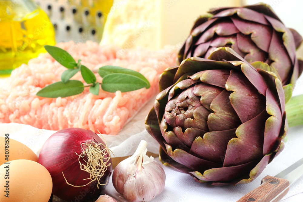 Fototapeta premium Fresh and uncooked stuffed artichoke ingredients