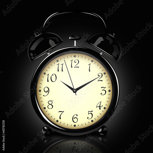 Alarm clock on the dark background