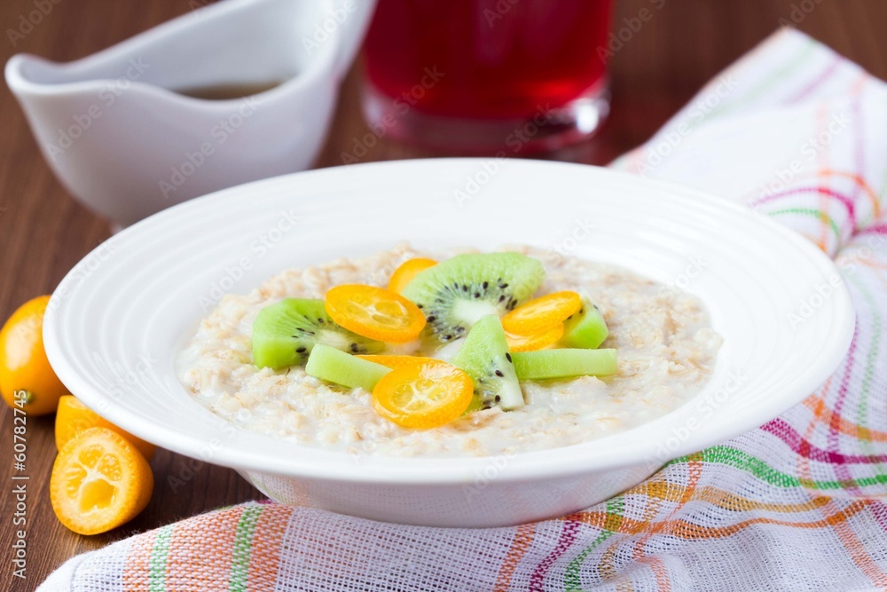 Oat porridge with fruit, orange, cumquat, kiwi, maple syrup Oat porridge with fruit, orange, cumquat, kiwi, maple syrup