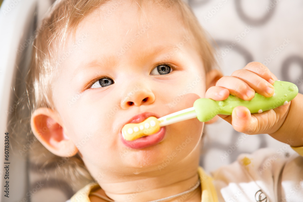 Portrait of baby girl cleaning teeth with toothbrush Portrait of baby girl cleaning teeth with toothbrush