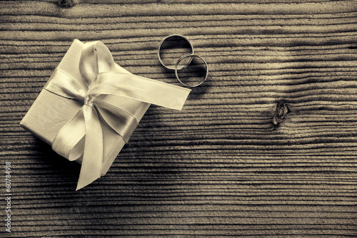 Engagement ring with gift box - wood background