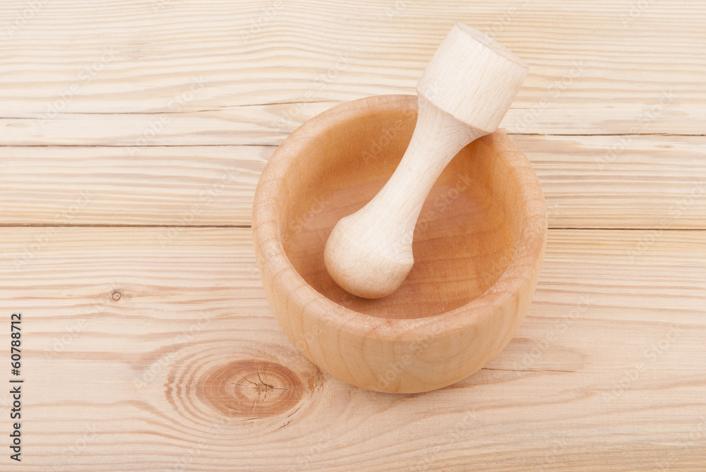 Wooden mortar with pestle.