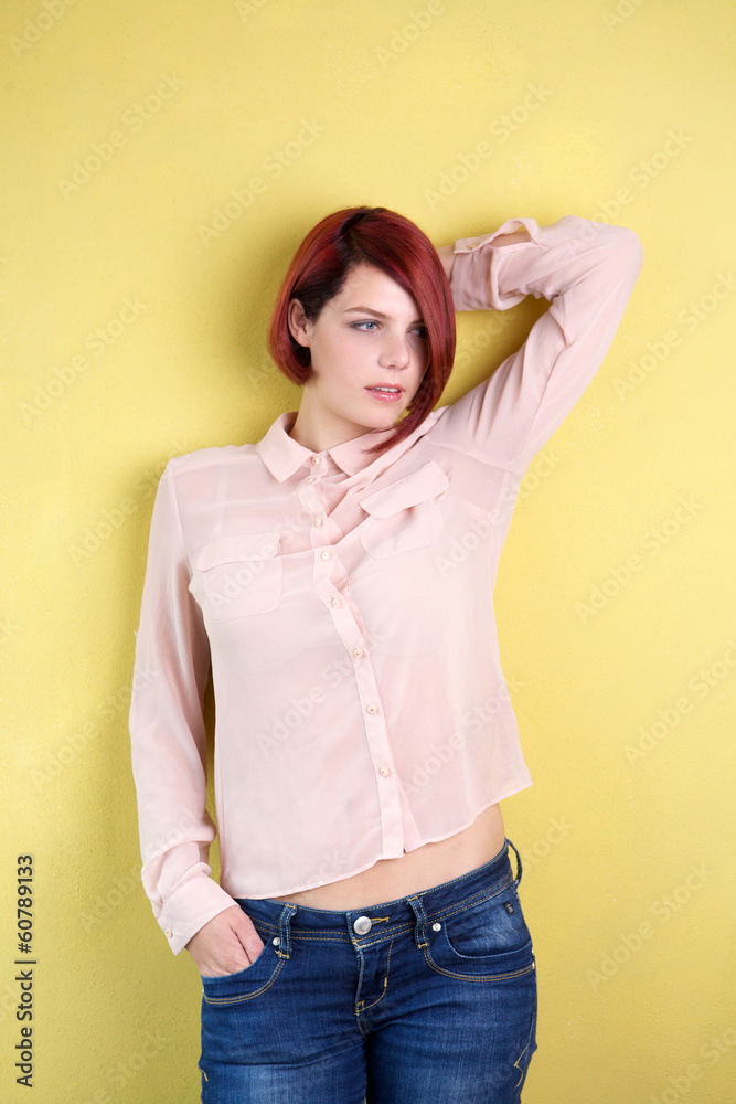 Female fashion model posing with hand in hair Female fashion model posing with hand in hair