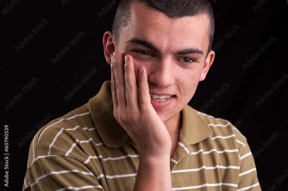 A shocked and surprised young man looking at the camera A shocked and surprised young man looking at the camera