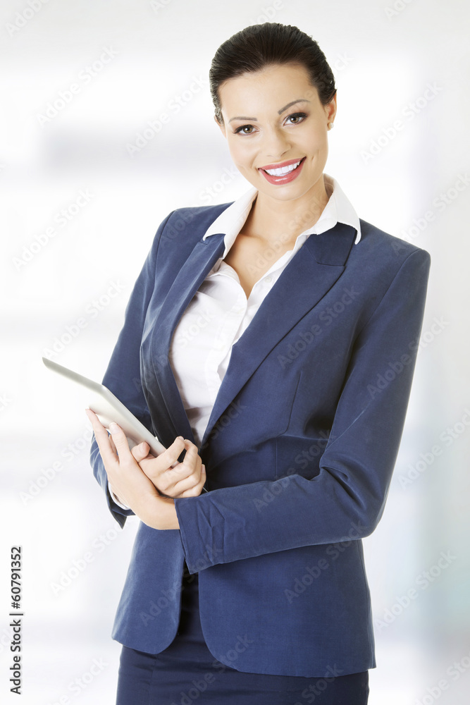 Attractive businesswoman using tablet computer Attractive businesswoman using tablet computer