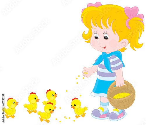 Girl feeds chicks
