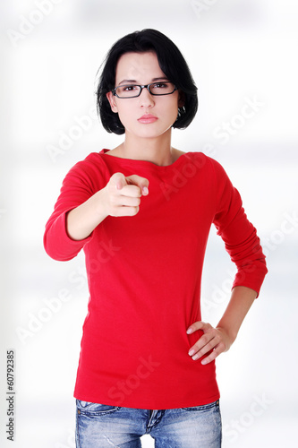 Young beautiful caucasian woman pointing on you photo