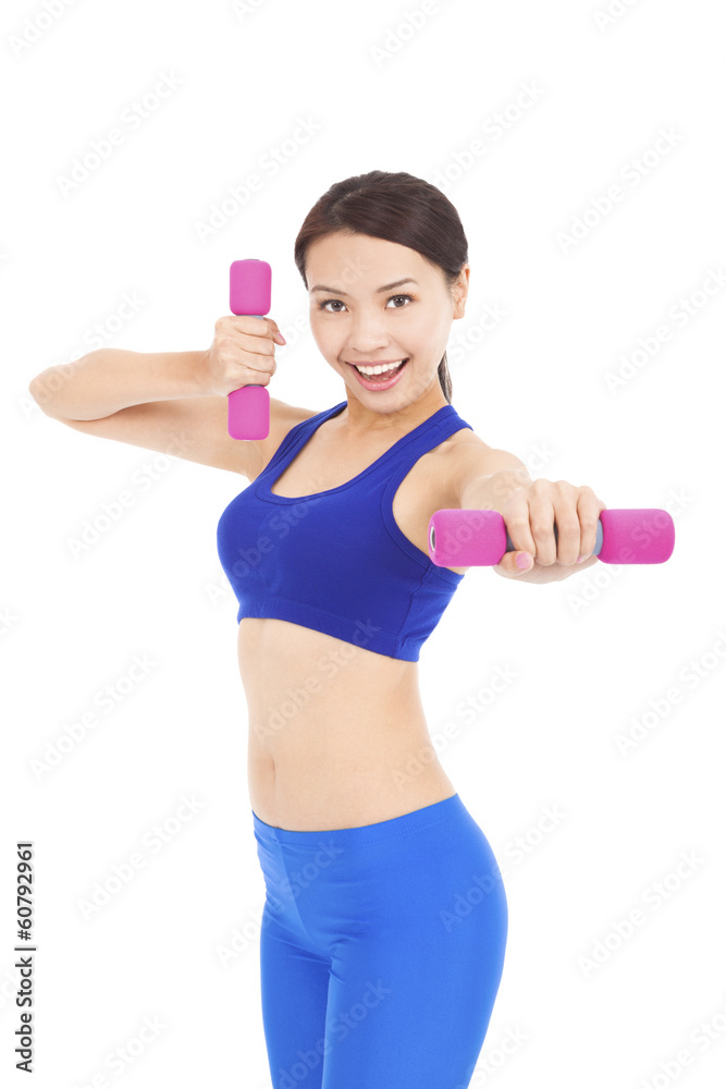 Young woman working out with dumbbells in her hands Young woman working out with dumbbells in her hands