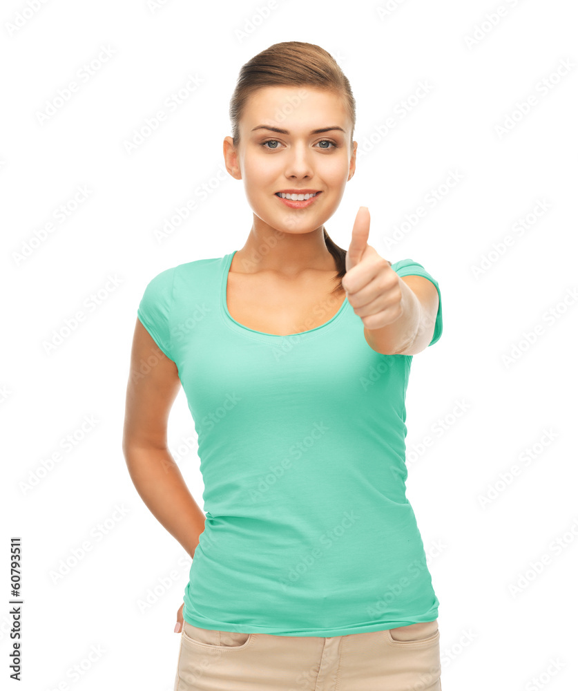 woman in blank blue t-shirt showing thumbs up woman in blank blue t-shirt showing thumbs up