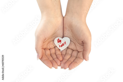 Paper heart protected in cupped hands