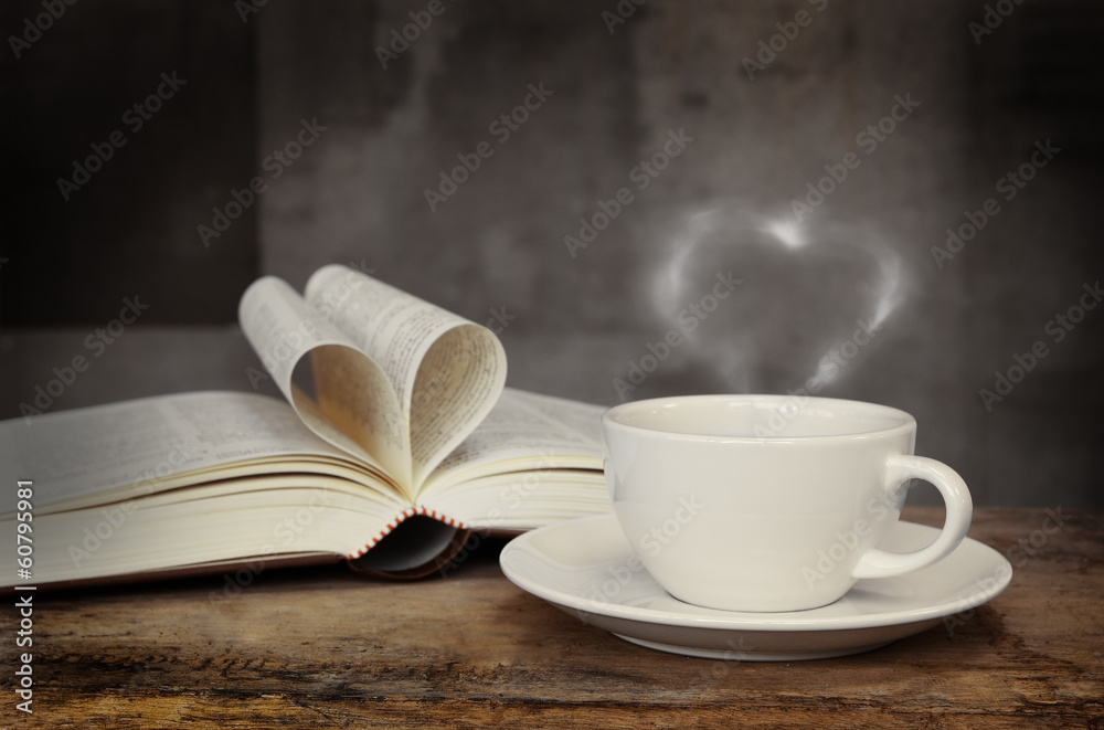Still life with cup of coffee and book on grunge wood table in v Still life with cup of coffee and book on grunge wood table in v