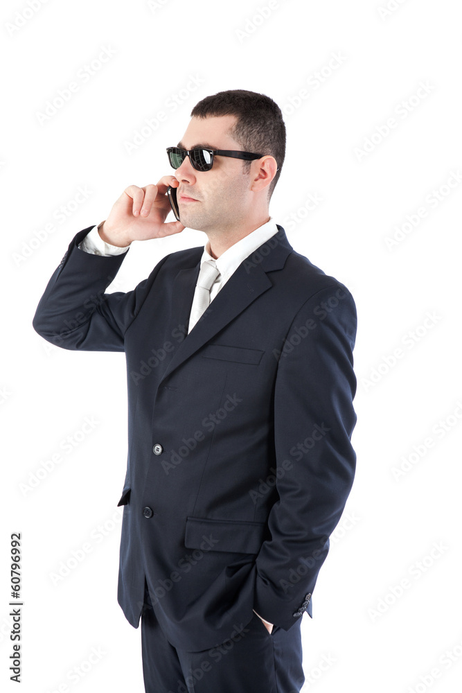 Isolated businessman talking on cellphone Isolated businessman talking on cellphone