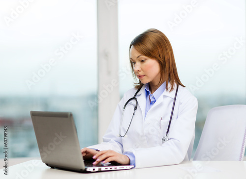 busy doctor with laptop computer