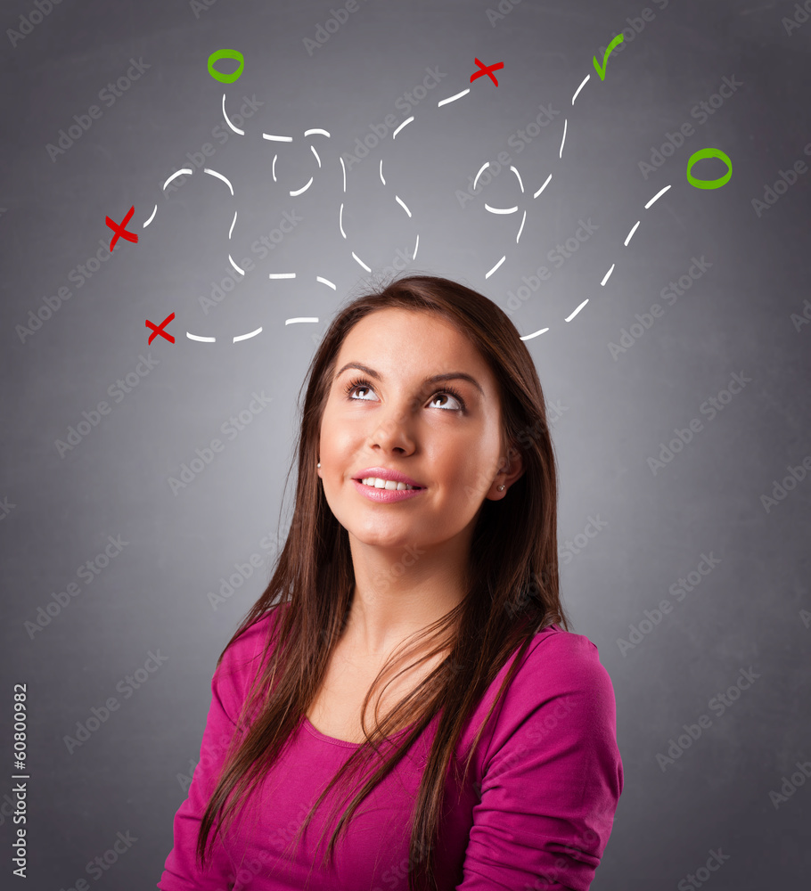 Young woman thinking with abstract marks overhead Young woman thinking with abstract marks overhead