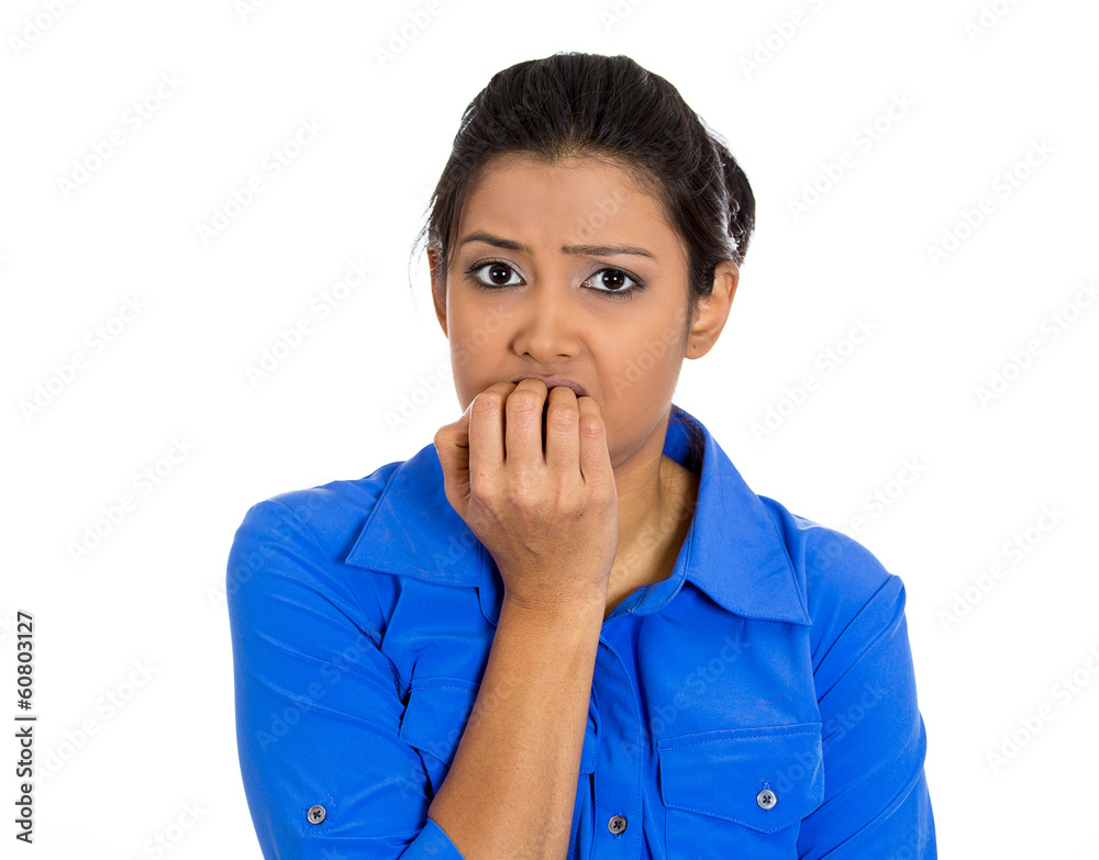 Unhappy, stressed, anxious woman biting fingernails Unhappy, stressed, anxious woman biting fingernails