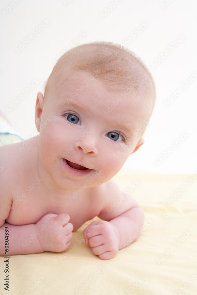 Bond little baby blue eyes lying down smiling Bond little baby blue eyes lying down smiling