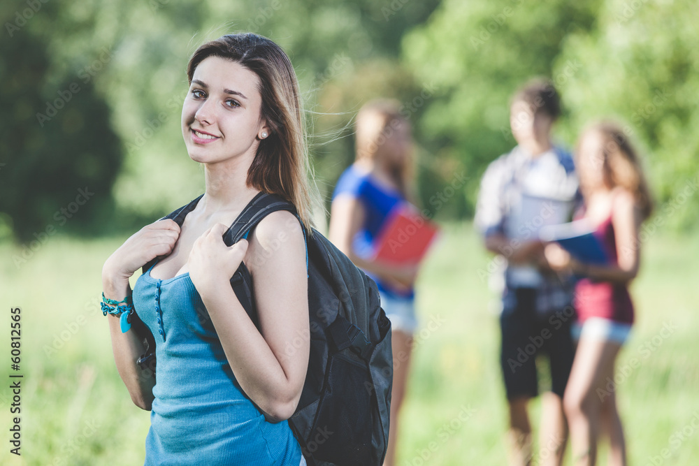 Young Female Student at Park with Friends Young Female Student at Park with Friends