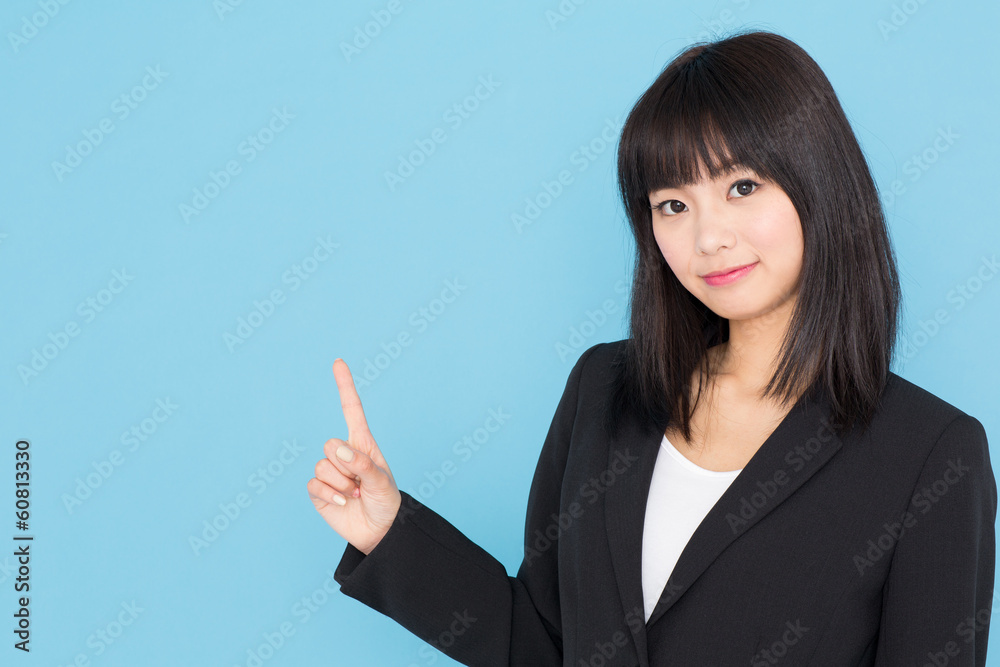asian businesswoman showing on blue background asian businesswoman showing on blue background