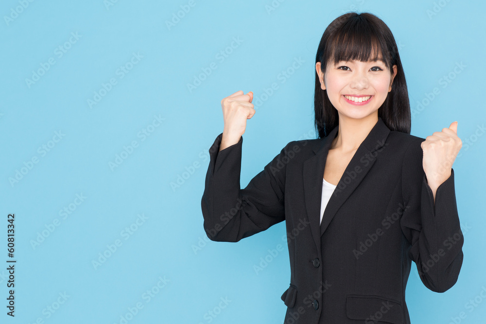 asian businesswoman cheering on blue background asian businesswoman cheering on blue background