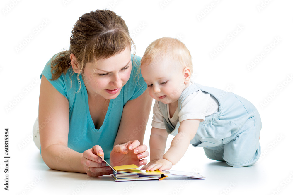 mother reading a book to her baby boy mother reading a book to her baby boy