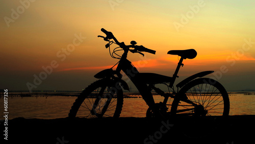 Mountain bike silhouette with sunset sky