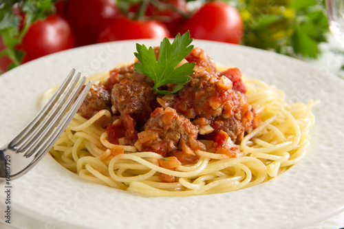 Pasta with meatballs in tomato sauce.