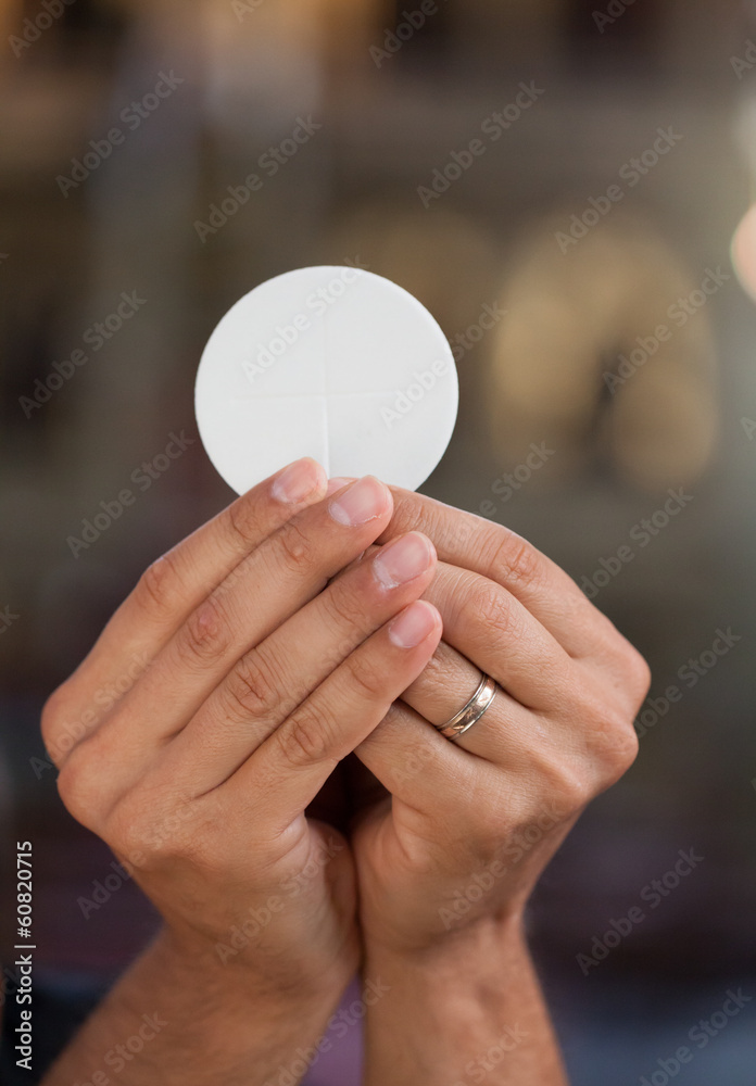 Hands with bread for holy communion. Hands with bread for holy communion.