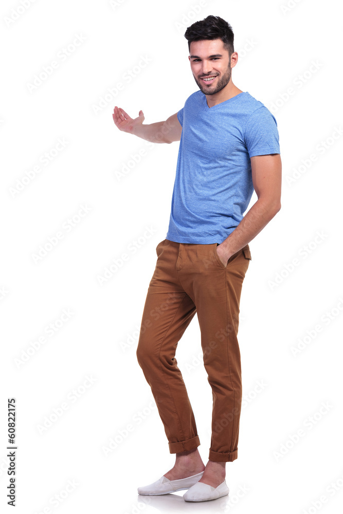 young casual man presenting something young casual man presenting something