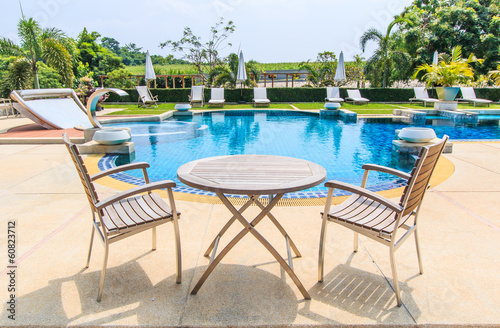 Table and chairs beside the pool