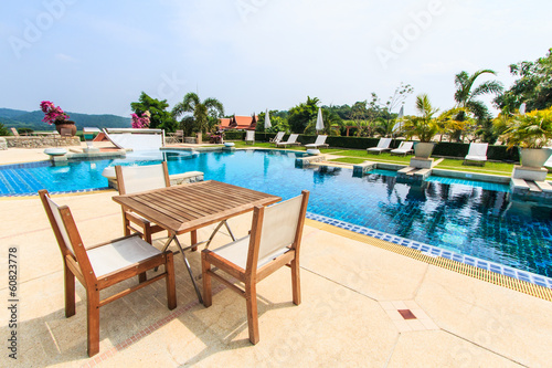 Table and chairs beside the pool