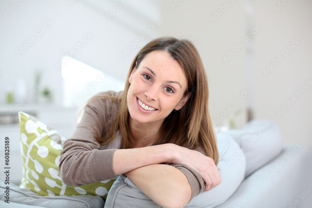 Portrait of beautiful girl sitting in couch Portrait of beautiful girl sitting in couch