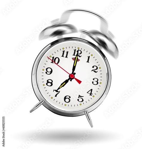 classical alarm clock ringing on white background
