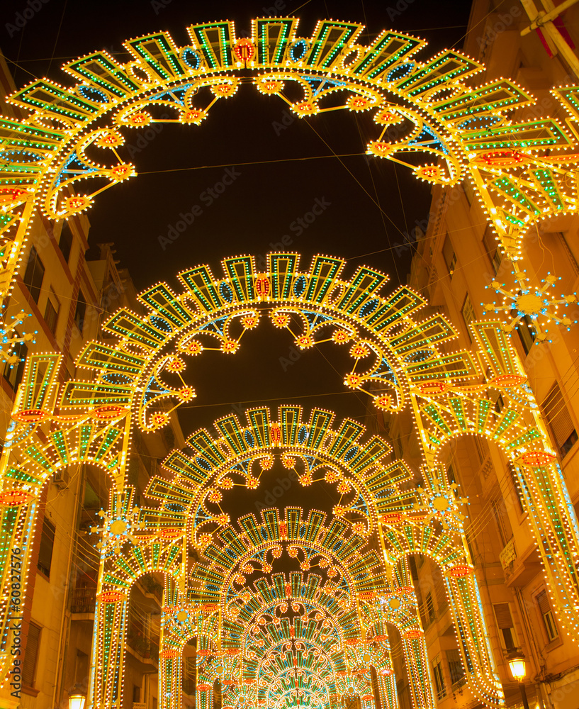 Obraz premium Beautiful night lights in Fallas fest of Valencia in calle Sueca