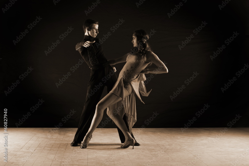 dancers in ballroom against on black background dancers in ballroom against on black background