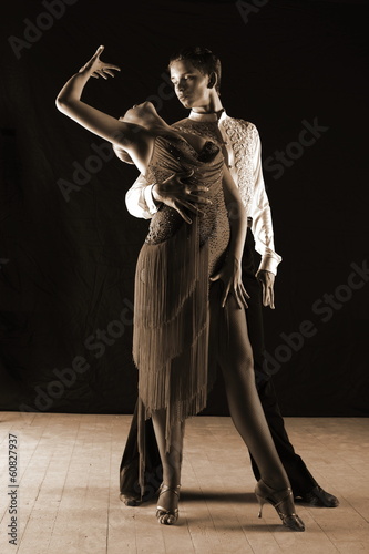  dancers in ballroom isolated on black