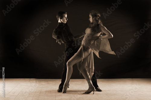 dancers in ballroom isolated on black background © konstantant