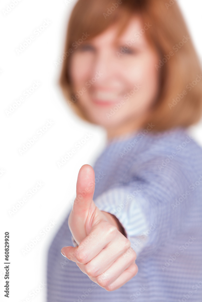happy middle aged woman showing a thumb up sign isolated happy middle aged woman showing a thumb up sign isolated
