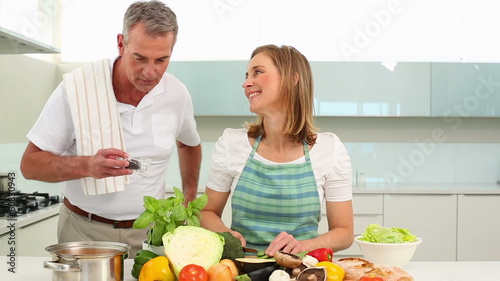 Mature couple preparing dinner together