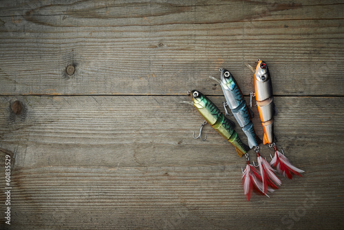 colorful lures on the wooden pier