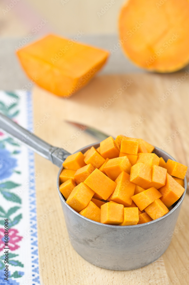 Preparing raw pumpkin for cooking Preparing raw pumpkin for cooking