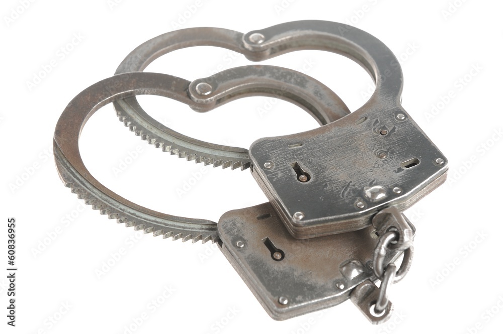 Obraz premium Handcuffs in heart shape isolated
