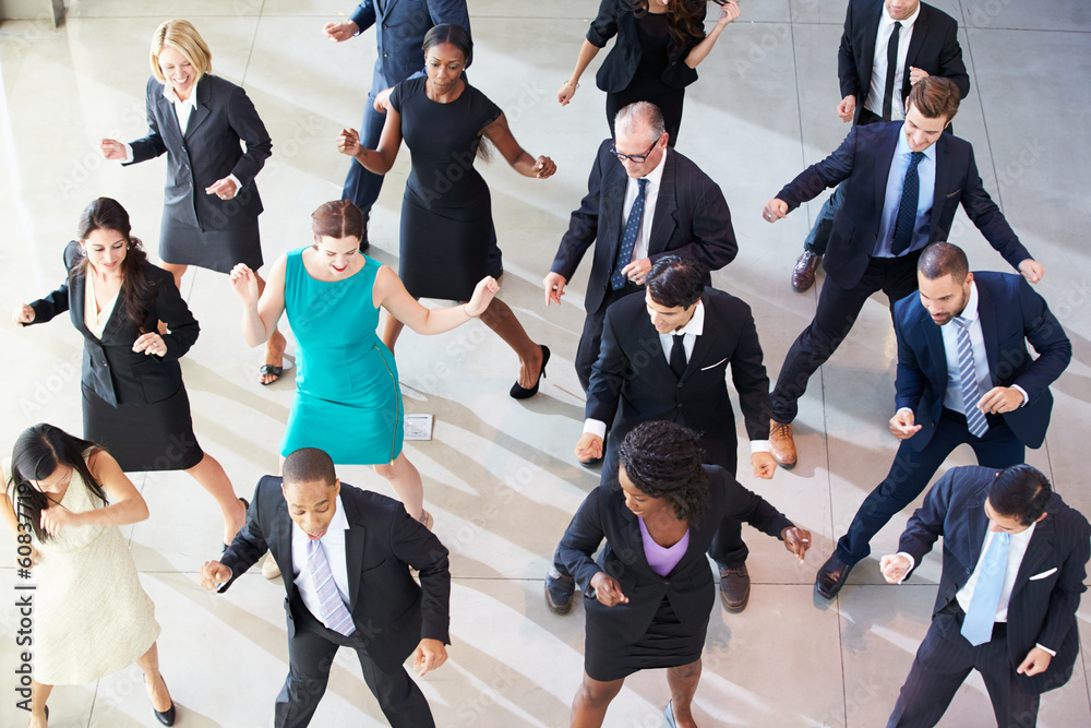 Overhead View Of Businesspeople Dancing In Office Lobby
