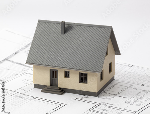 concept of new house project with architect blueprint