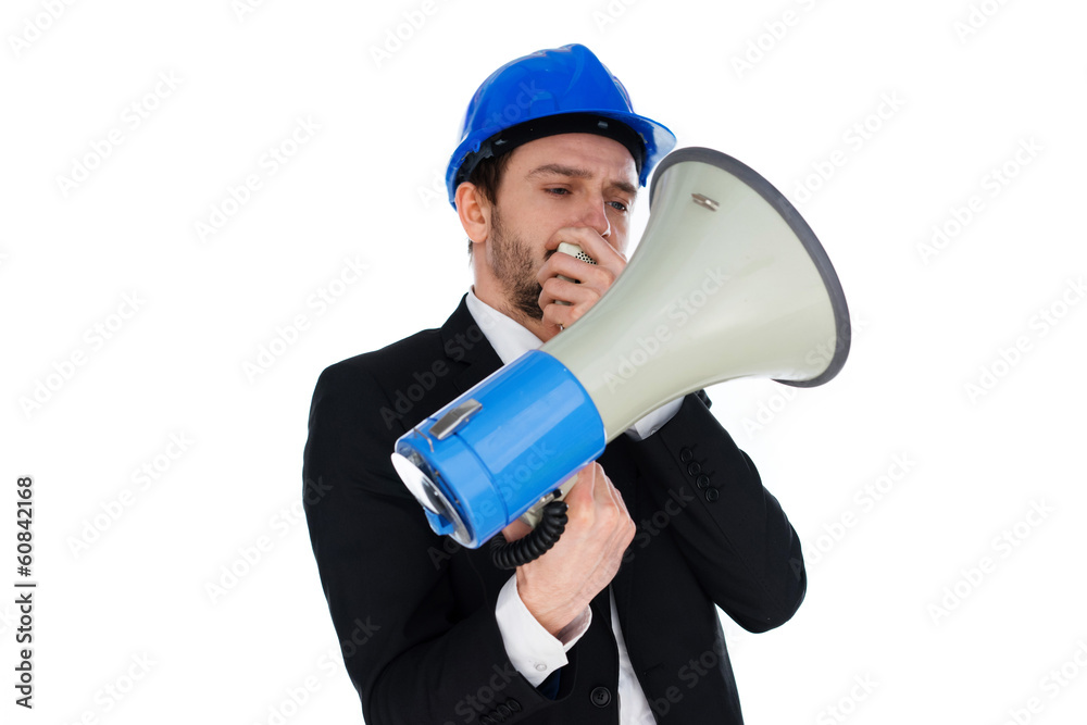 Businessman wearing a hardhat holding a megaphone