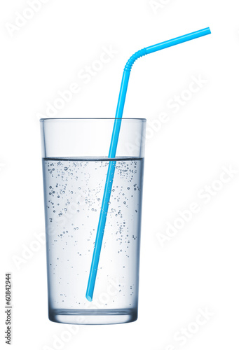 glass of mineral water and drinking straws on white background