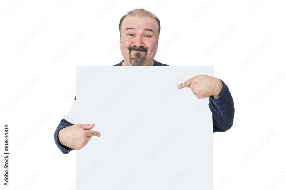 Smiling man holding and pointing to a billboard Smiling man holding and pointing to a billboard