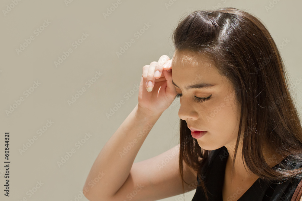 woman suffers from headache, fatigue under heat of strong sun woman suffers from headache, fatigue under heat of strong sun