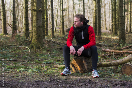 A man taking a rest from running